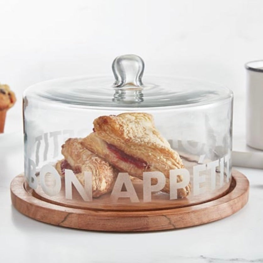 hand-blown glass cloche features a frosted decal and acacia wood tray.