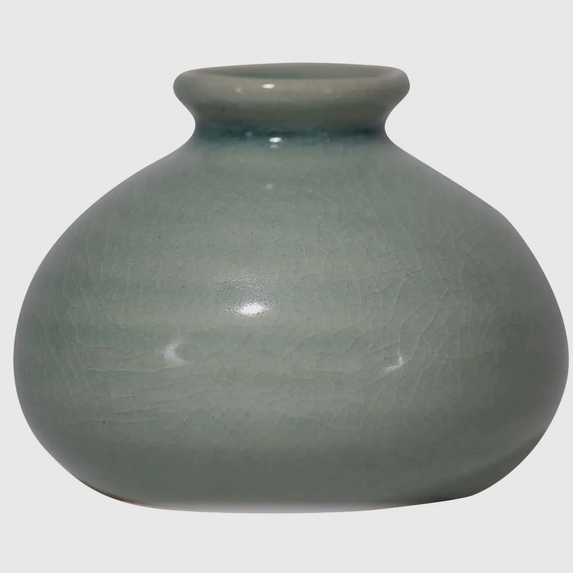 A simple blue-green crackle glaze adorns the ribbed bud vase shape. 